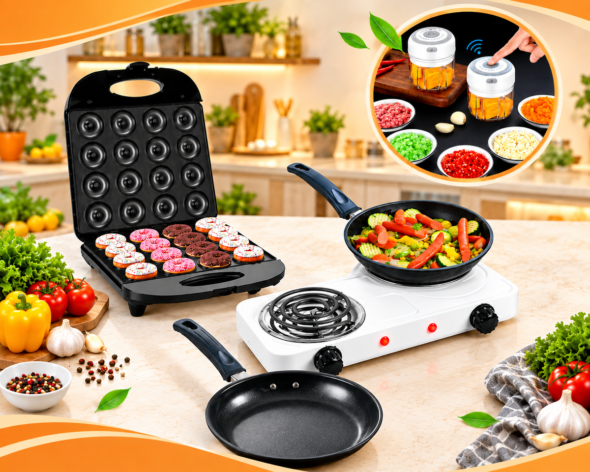 A kitchen countertop setup showing a black multi-level donut/griddle maker with pink and brown donuts inside, a white electric burner with a pan of colorful vegetables, a second empty black pan, and a circular inset demonstrating a handheld food-prep device. The scene is styled with fresh vegetables and a warm kitchen background.